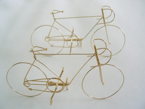 Bicycle is handmade from a single piece of wire, 2" high and 3" long.