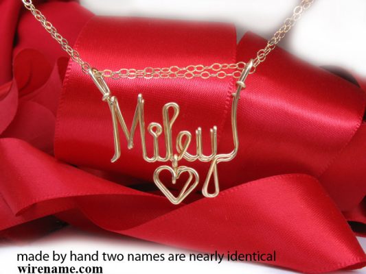 Made by hand two names are identical. Wire gold necklace.