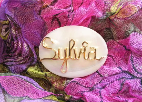 Pearl brooch, MOP (MOTHER-OF-PEARL) with a beautiful shimmer and wire name.